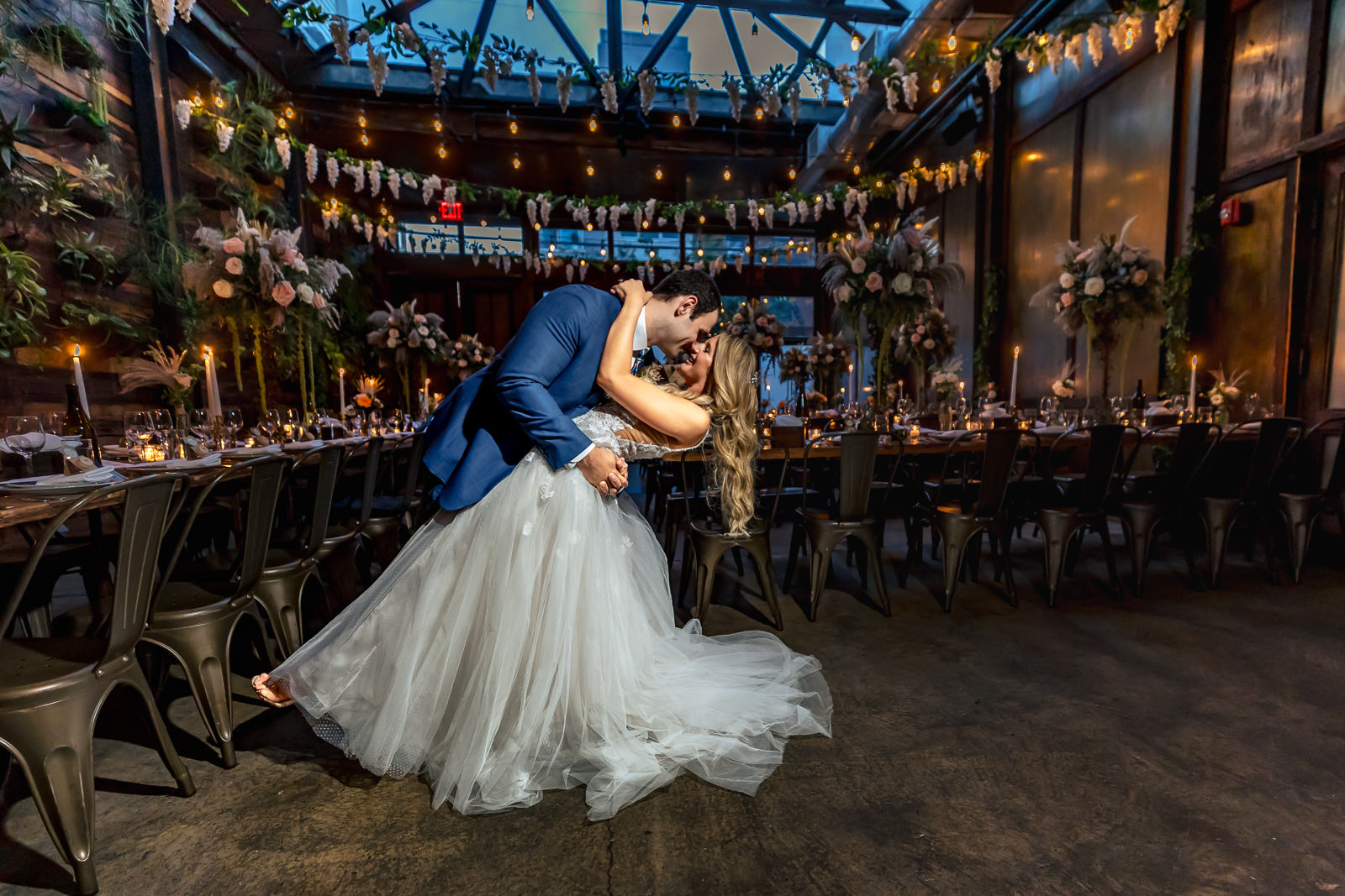 Paola and Alex sharing a dance inside Brooklyn Winery reception space.