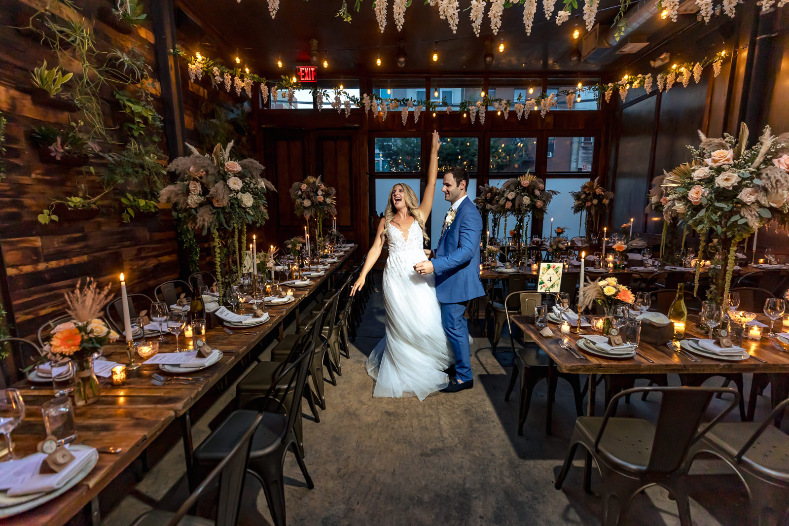 Paola and Alex embracing inside Brooklyn Winery during their wedding day.