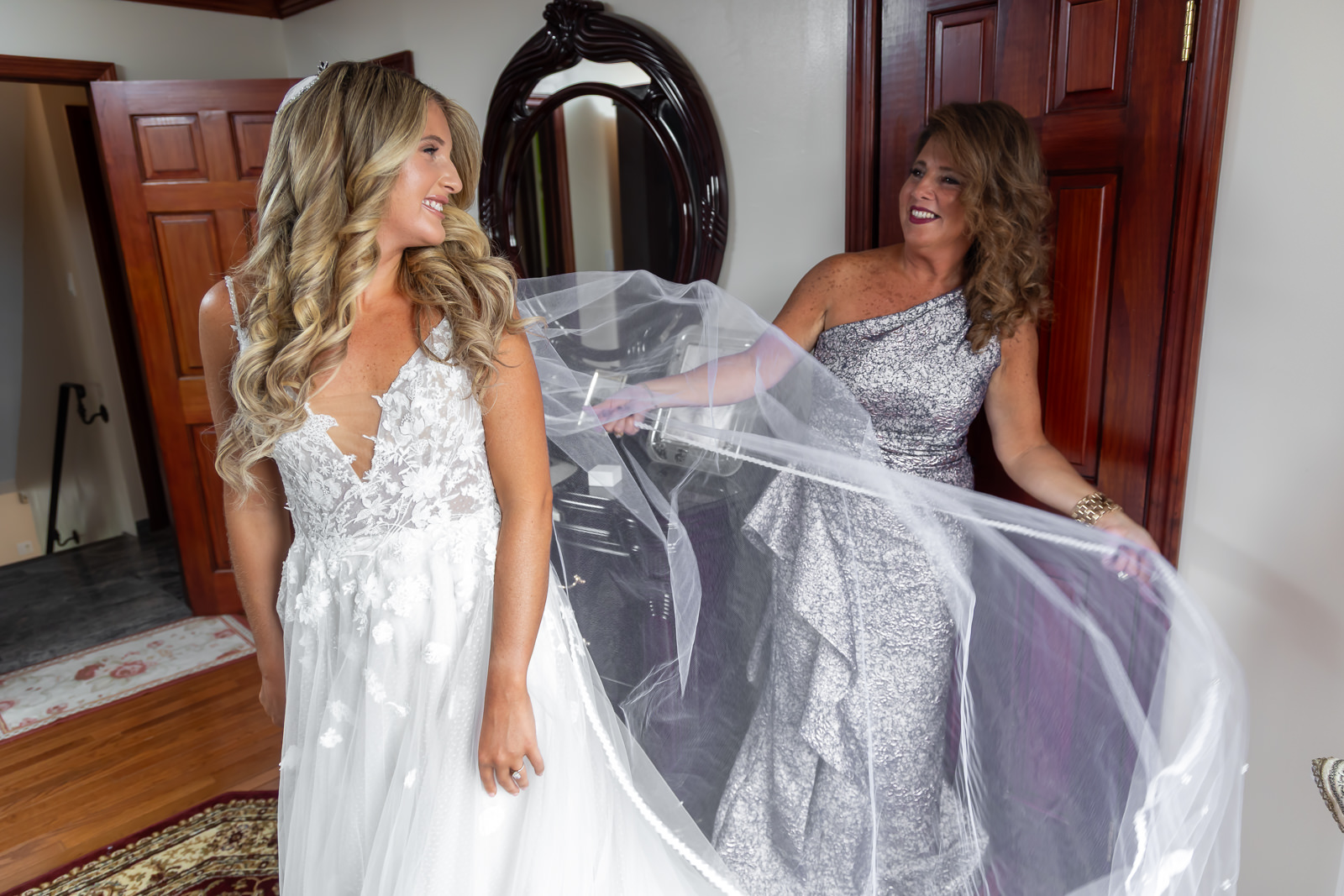 Bride getting ready with family member before her Brooklyn Winery wedding.