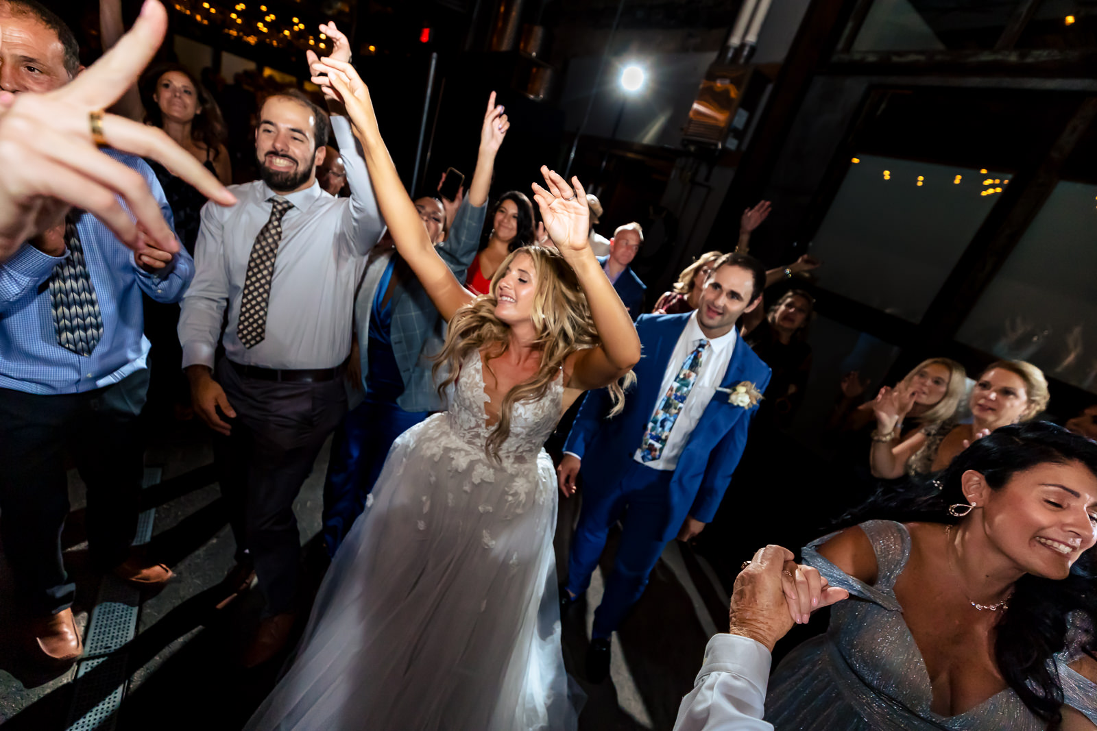 Bride dancing with guests during the reception at Brooklyn Winery.