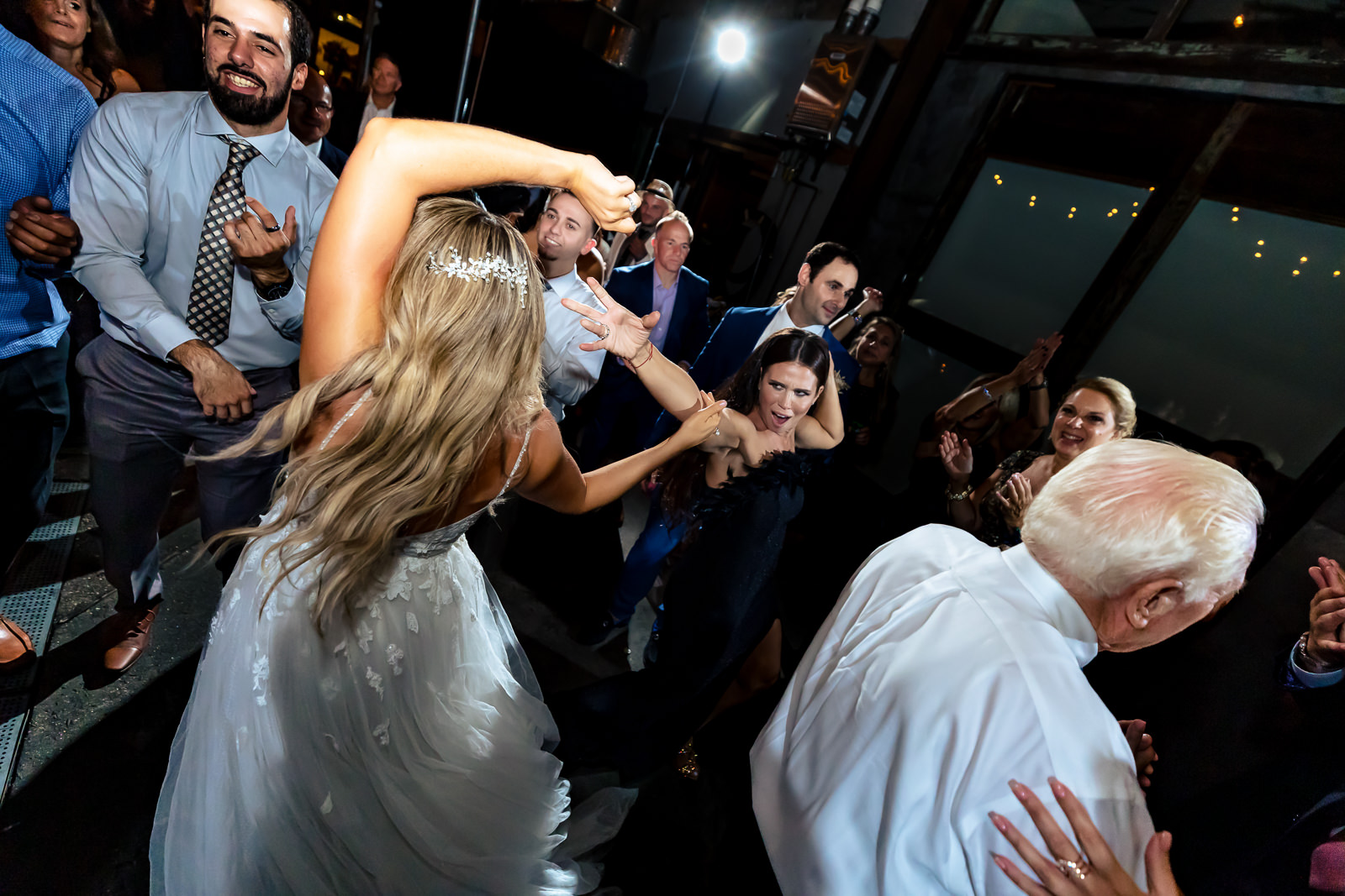 Bride dancing with guests during a Brooklyn Winery wedding reception.