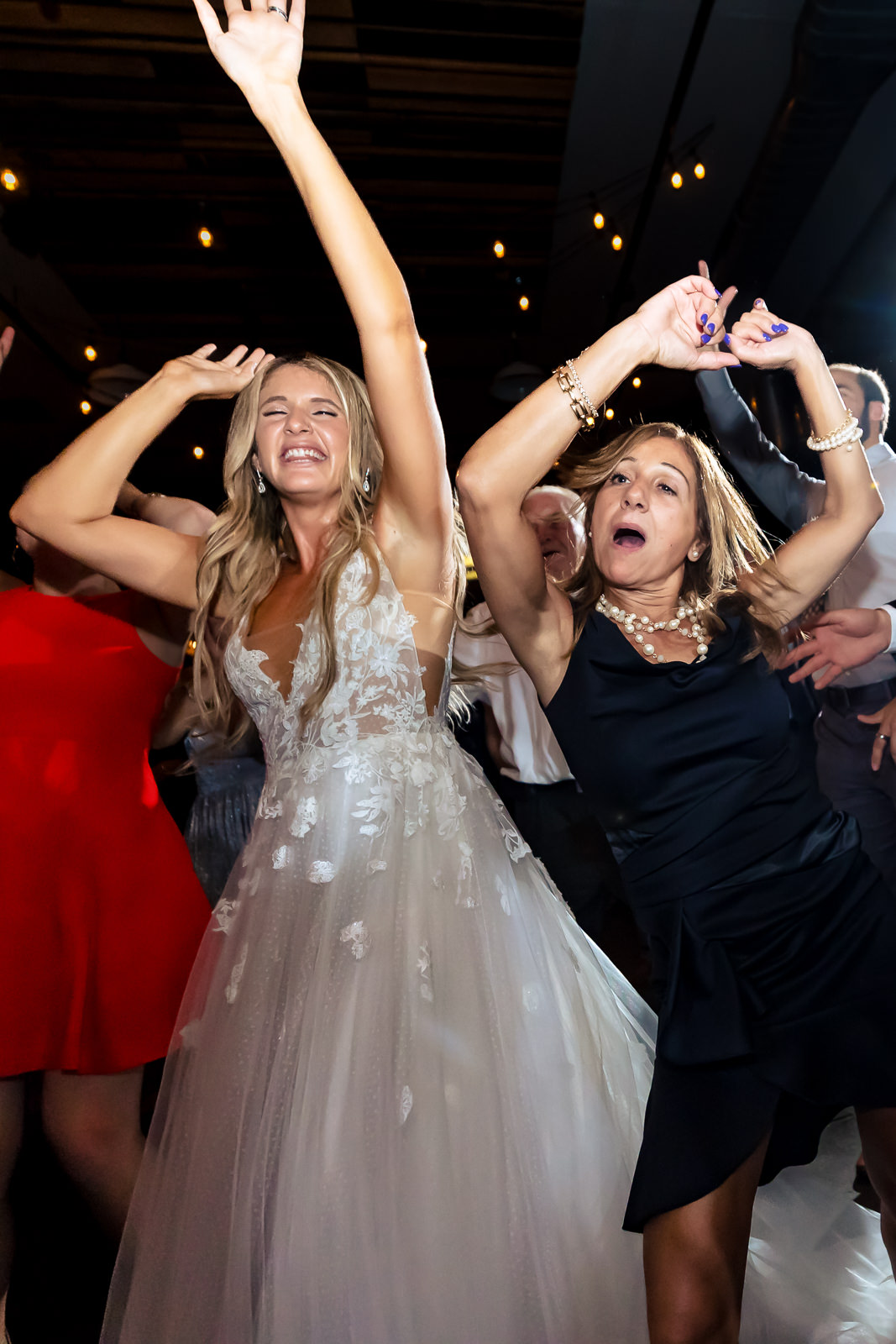 Bride and guest dancing together during reception at Brooklyn Winery.