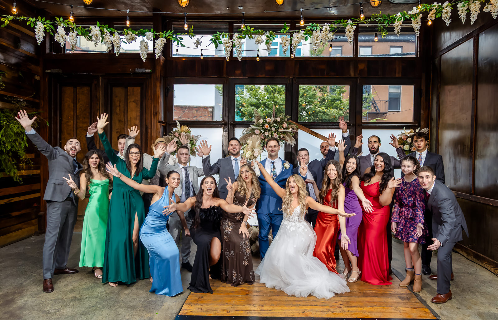 Colorful wedding party portrait inside Brooklyn Winery in Williamsburg, Brooklyn.